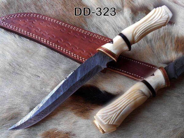 13 " long Damascus steel skinning knife, exotic hand carved Camel bone scale crafted with engraved brass, spacer and sliced bull horn, Cow hide leather sheath included.